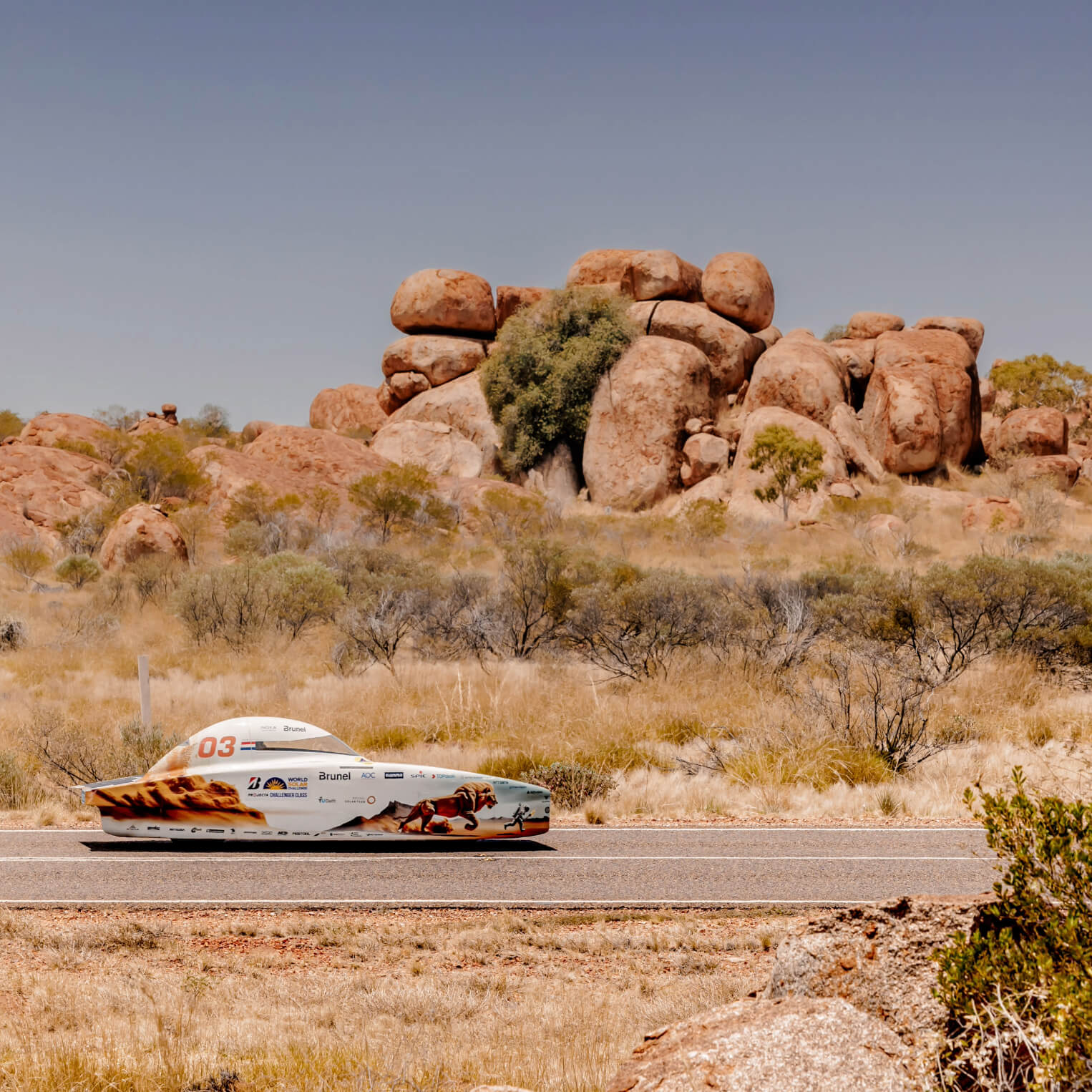 The Brunel Solar Team car driving on a road in the desert