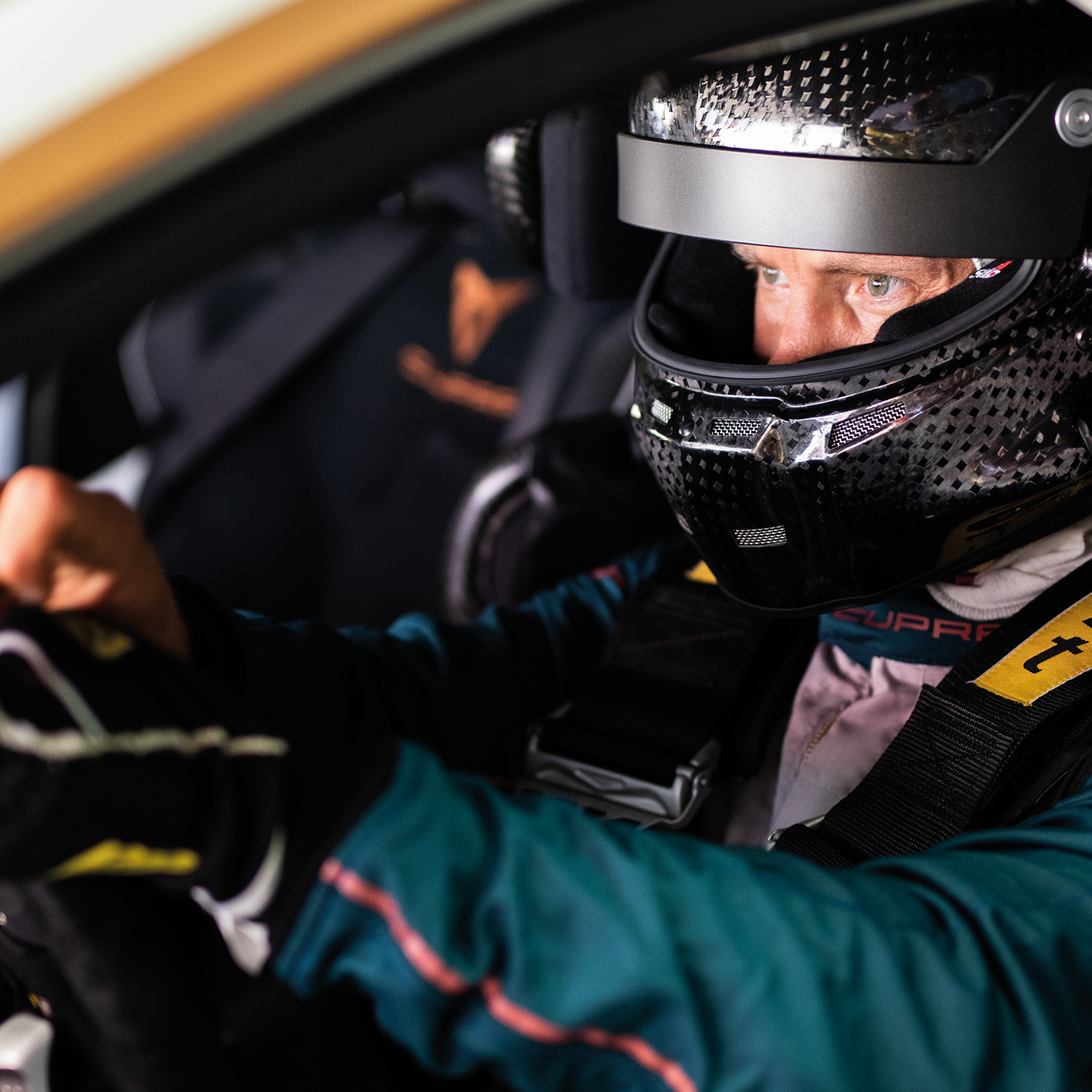 Mattias Ekström wearing a helmet in the driver's seat