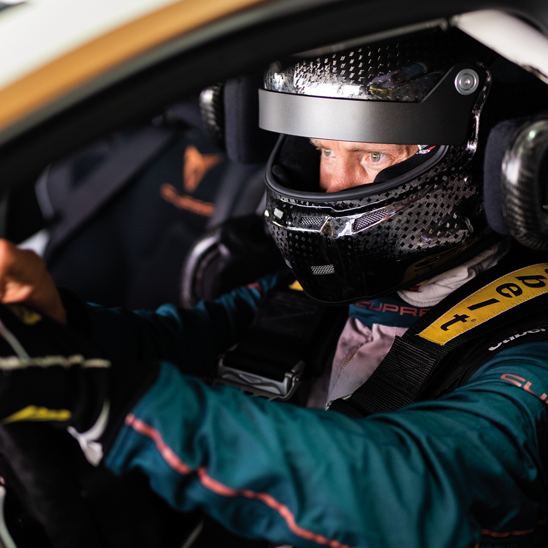 Mattias Ekström wearing a helmet in the driver's seat