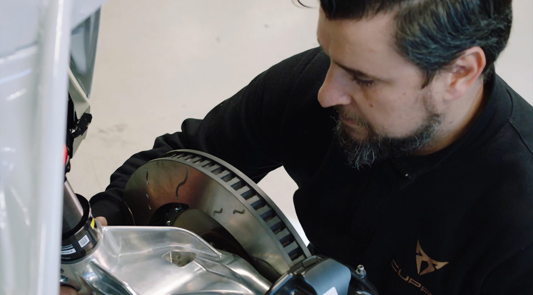 Worker inspecting an engine component