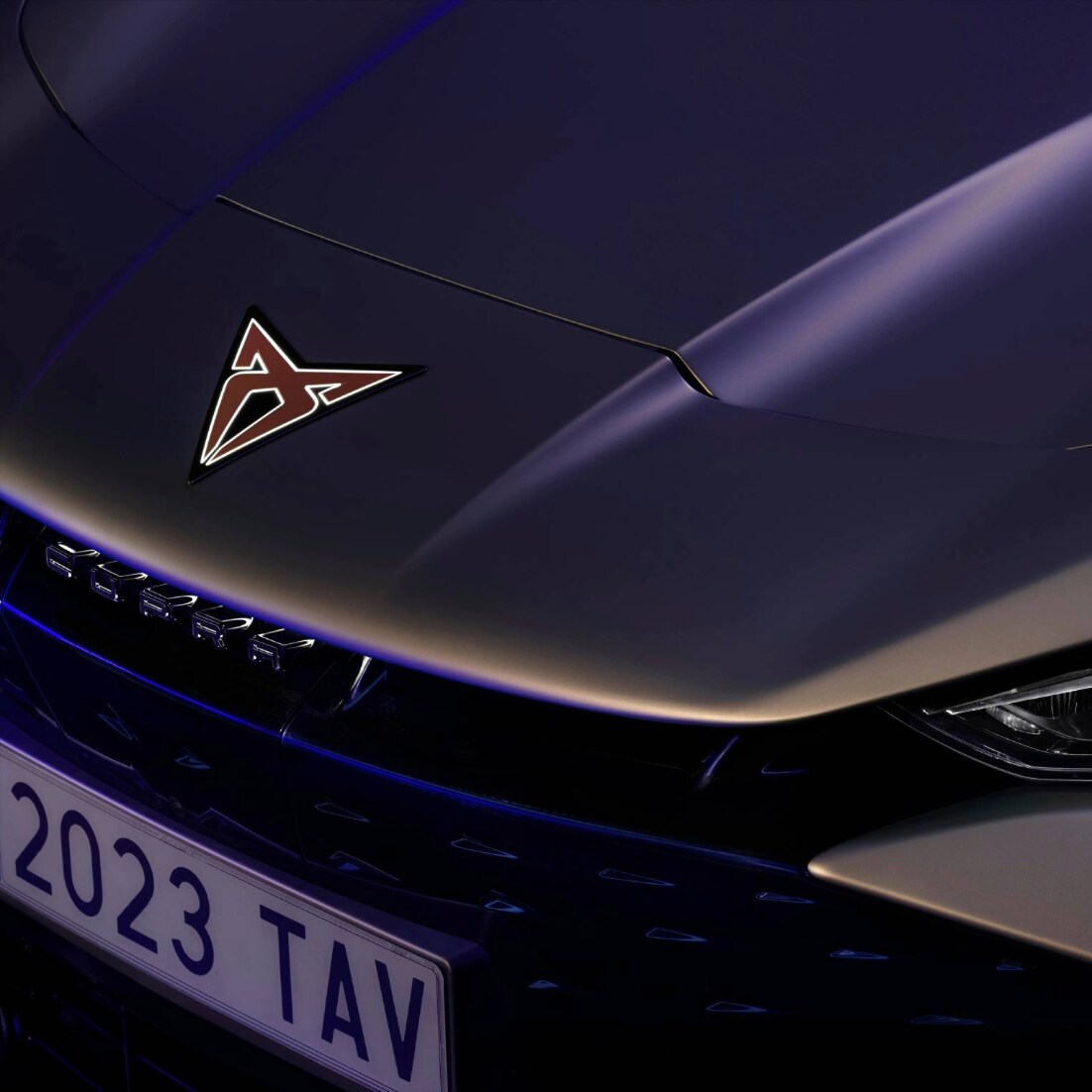 Close-up of CUPRA Tavascan bonnet with badge, and headlight Close-up of CUPRA Tavascan bonnet with badge, and headlight