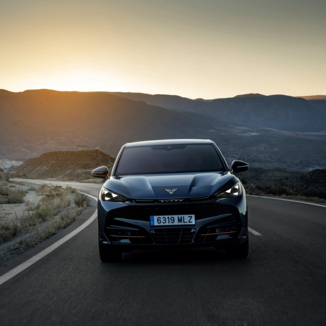 CUPRA Tavascan driving in mountains