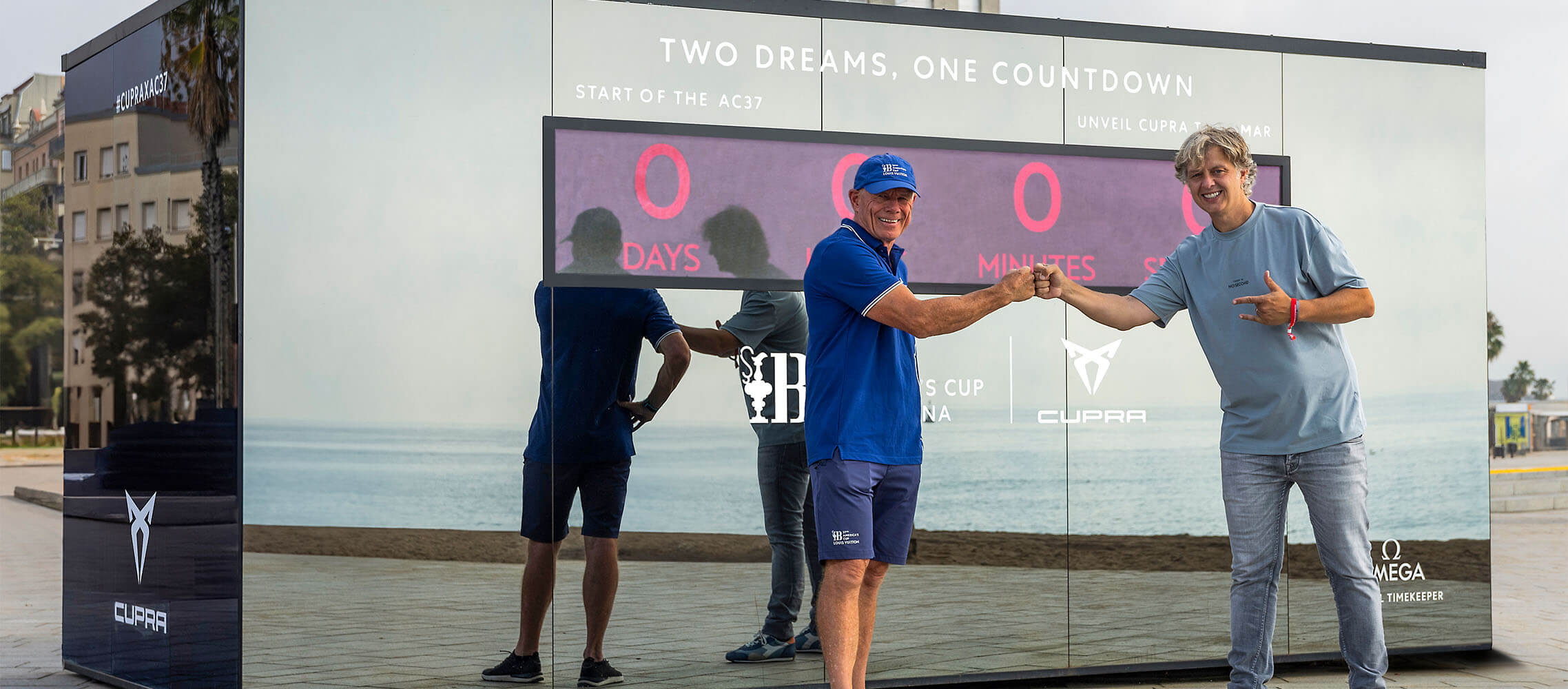 countdown display during the unveiling of the new CUPRA Terramar, with the event backdrop showcasing the two dreams, one countdown slogan, the CUPRA logo, and barcelona cityscape in the background