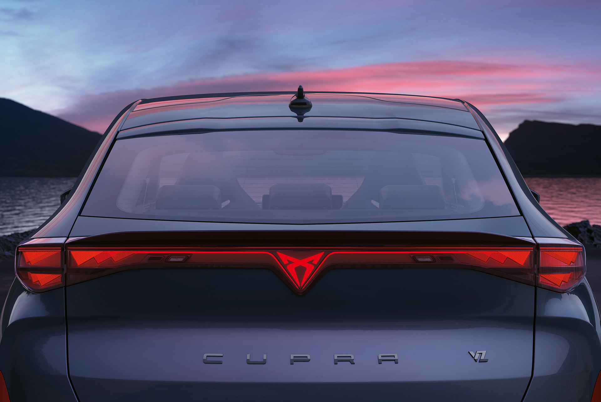 Rear view of the 2024 CUPRA Tavascan with coast-to-coast lighting