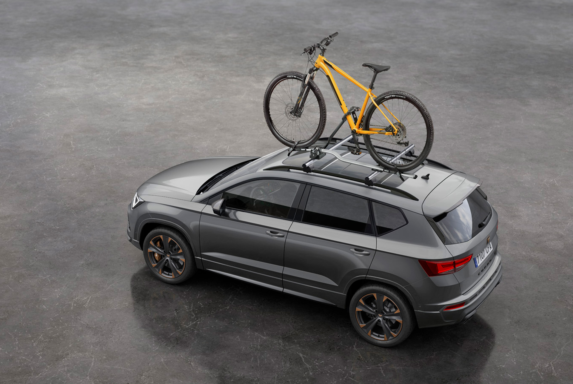 CUPRA Ateca equipped with a specially created bike roof rack, ready for an adventurous journey. 