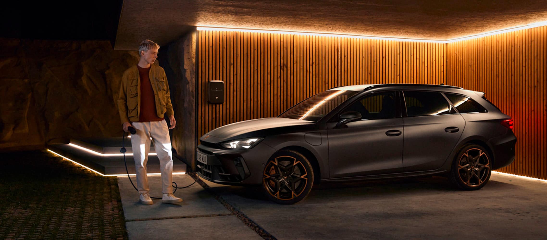 cupra leon plug-in hybrid sportstourer parked in a garage with ambient lighting